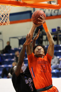 Victor Bell (14) of Angelina College battles Blinn’s Jaequan Brown during Wednesday’s game at Shands Gymnasium. The Roadrunners won an 89-86 thriller over the Bucs to remain in second place in the conference’s South Zone. (AC Press photo by Caitlyn Lambert)