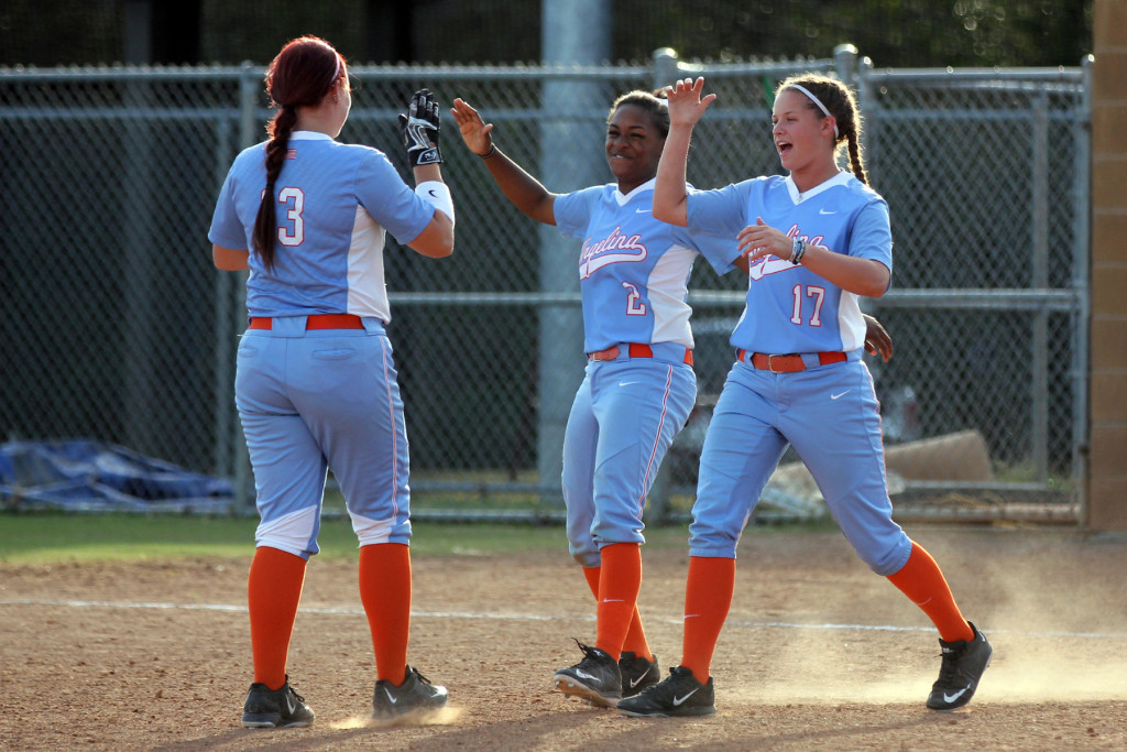 Angelina College’s Shawneece Jones (2) and Kali Holcombe (17) greet teammate Kayla Boucher (13) after Boucher’s double in the bottom of the eighth inning gave the Lady Roadrunners a 5-4, walk-off win over Bossier Parish Monday at Roadrunner Complex. The Lady Runners earned the sweep after blanking the Lady Cavs 7-0 in the opener. (AC Press photo)