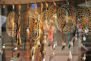 A vendor sells handmade dream catchers at the festival.