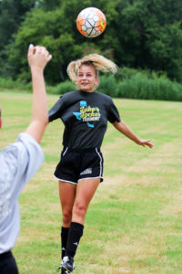 Angelina College soccer player Carley Elkins bumps a header during the program’s first-ever practice session held Monday on the AC campus. The Lady Roadrunners and Roadrunners open their inaugural season Thursday with a pre-season doubleheader at the University of Houston-Victoria. (AC Press photo by Gary Stallard)