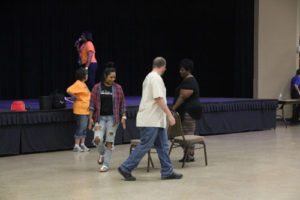 Participants play a game of musical chairs at the Heritage Festival.