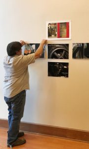 Angelina College student Richard G. Hardesty hangs images that will be shown in the graphic arts student exhibition Nov. 1 at 6 p.m. in the Angelina Center for the Arts gallery. Admission is free.