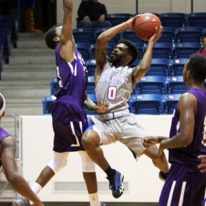 Corinthian Ramsey (0) of Angelina College fights for a shot over an Arkansas Baptist defender during Monday’s game. The Roadrunners held off the Buffaloes in a 92-89 thriller at Shands Gymnasium. (AC Press photo/Marcella Flores)