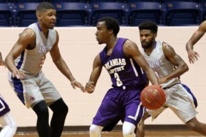 Angelina College defenders Robert Lewis (33) and Corinthian Ramsey (0) swarm Arkansas Baptist’s Charles Shaw during Monday’s game. The Roadrunners held off the Buffaloes in a 92-89 thriller at Shands Gymnasium. (AC Press photo/Marcella Flores)