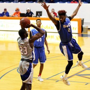 Angelina College’s Shaq Gainey (23) launches a three pointer over Southwestern Christian College’s Jontavius Littles (2) during Friday’s game. (AC Press photo/Marcella Flores)