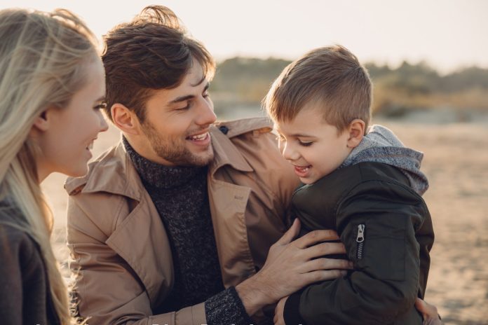 smiling-parents-with-son-spending-time-together-2022-12-16-19-44-42-utc-1-1