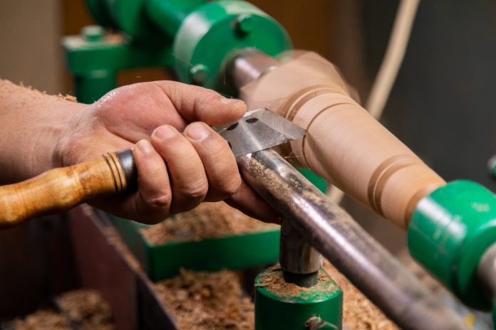 resized-closeup-of-carpenter-turning-wood-on-a-lathe-2022-05-17-17-34-11-utc