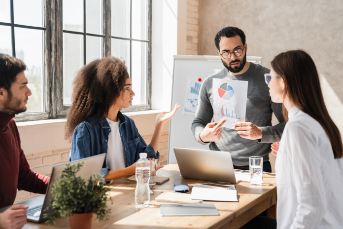 international-workers-group-and-team-leader-having-2025-01-10-03-36-24