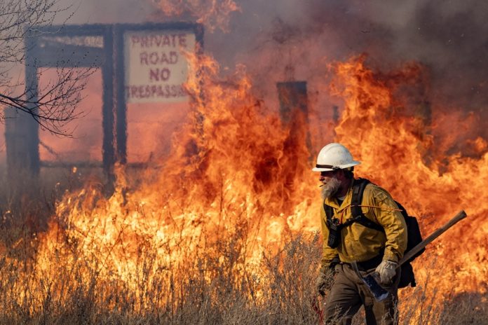 Firefighters battle parts of the reignited Smokehouse Creek fire outside of Miami, Texas on Saturday, Mar 02, 2024. (Sam Craft/Texas A&M AgriLife Marketing and Communications)